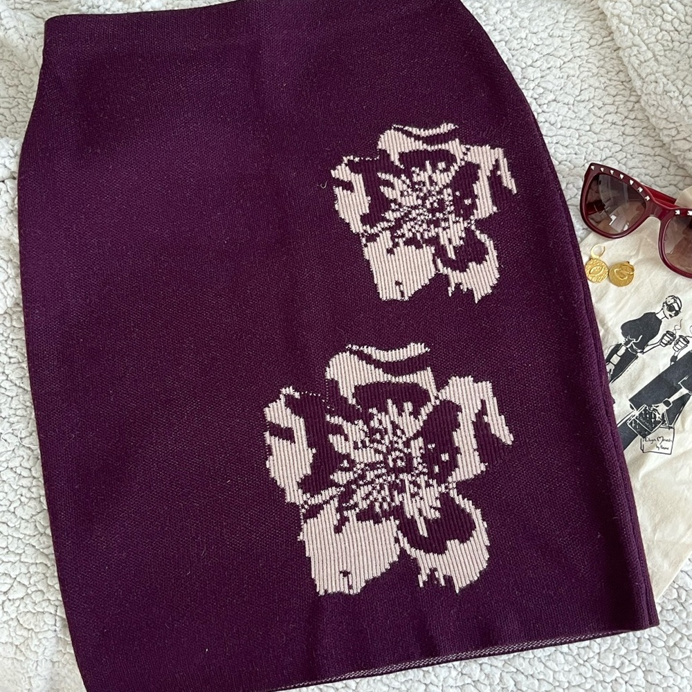 Burgundy skirt from Calvin Klein. I wore it one time. Like new condition.